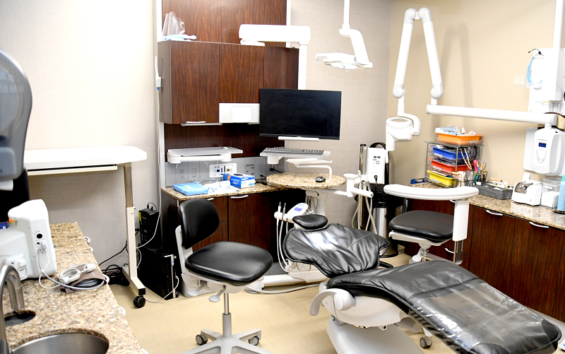 Fully equipped dental operatory with ergonomic chair, delivery system, and cabinetry